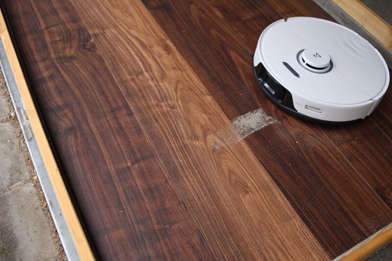 Vacuuming sand on hard floor